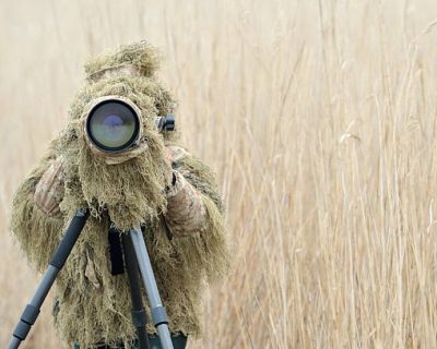 wildlife photographer outdoor wearing camouflage